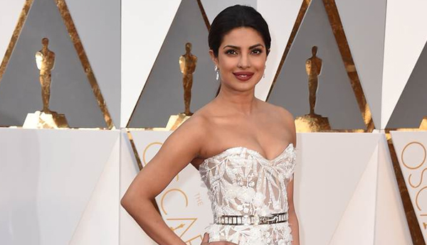 Priyanka Chopra Shines in White on Red Carpet in Oscars 2016