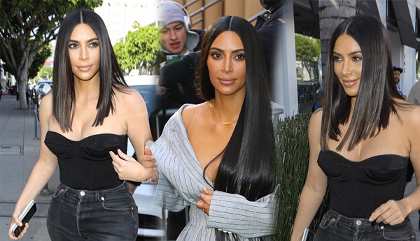Proportion parade! Kim Kardashian shows off new shorter hair after ditching extensions as she celebrates famed shape in high-waisted jeans