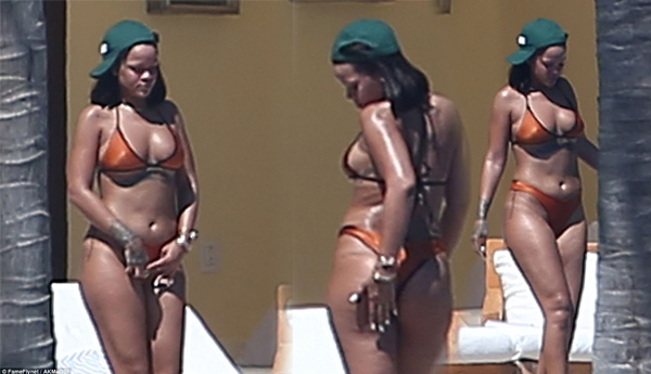 Bikini boss! Rihanna parades around in tiny two-piece and sips wine after treating her staff to lavish work retreat in Mexico
