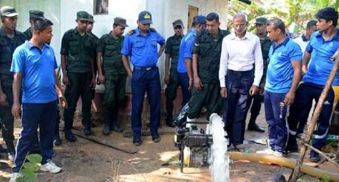 Navy relief teams give vast assistance to clean drinking water wells in North Navy relief teams give vast assistance to clean drinking water wells in North