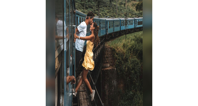 Couple criticized for hanging out of a train to take an Instagram photo in Sri Lanka