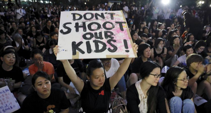 Protecting Hong Kong’s young protesters: ‘Beat us, don’t beat the kids’