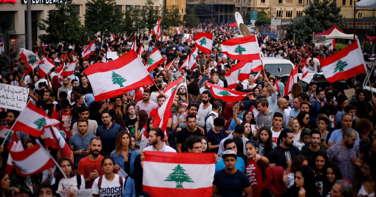Attacks and celebration as Lebanon PM says he will quit Attacks and celebration as Lebanon PM says he will quit