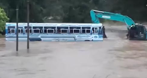 Bus carrying passengers swept away in floodwaters