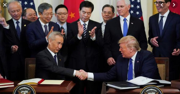 US and China sign deal to ease trade war