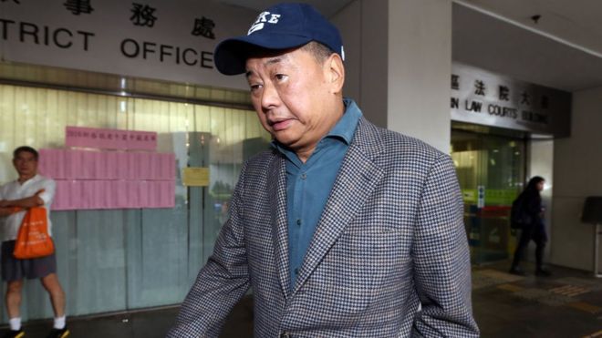 Jimmy Lai: Pro-democracy media tycoon arrested and charged