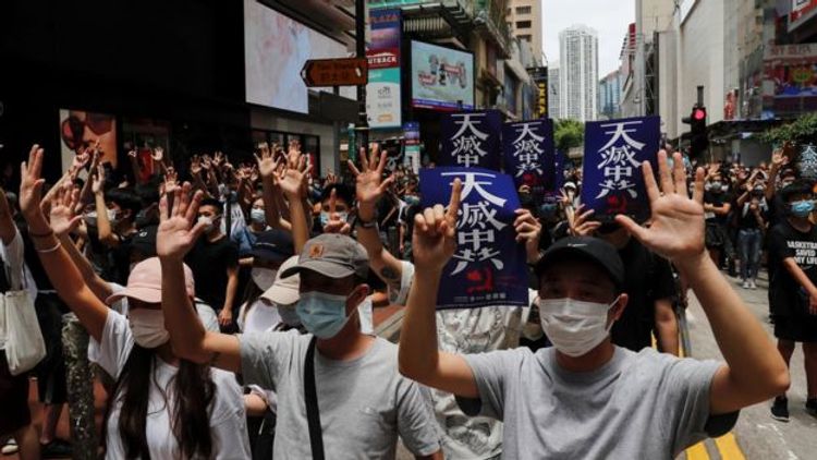 Hong Kong police fire tear gas as protesters decry China security law plan Hong Kong police fire tear gas as protesters decry China security law plan