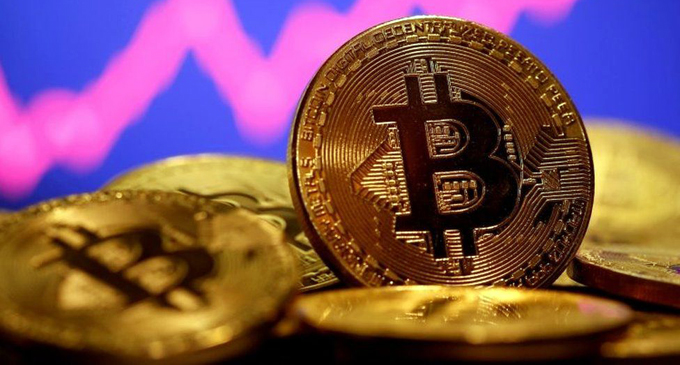 Bitcoin surges past USD 60,000 for first time