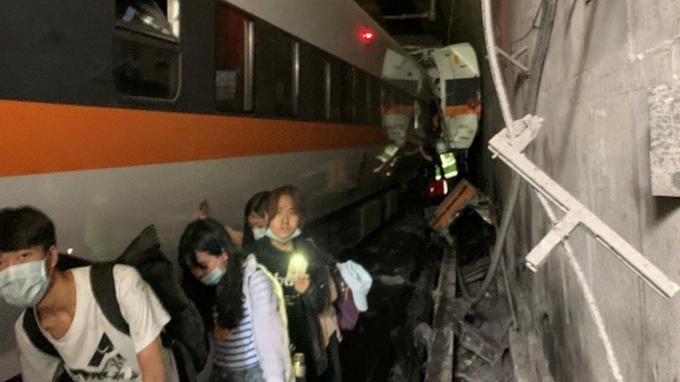 At least 34 killed as train derails in Taiwan At least 34 killed as train derails in Taiwan