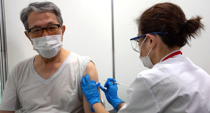 Japan ramps up mass vaccinations amid COVID-surge