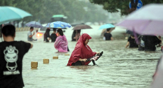 China floods leave 12 dead and thousands evacuated