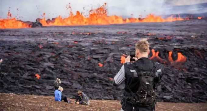 Lava spills out as volcano erupts in Iceland